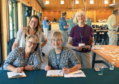 Board and staff at check-in table