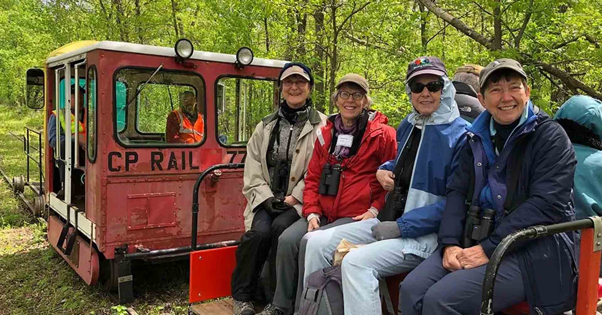 People Riding the Train through the Tiffany Wildlife Area